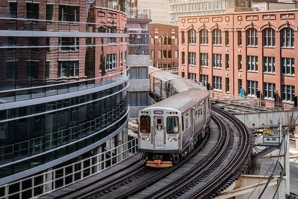 A Chicago L Train turns the corner at Merchandize Mart, where Regroup CEO David Cohn is speaking