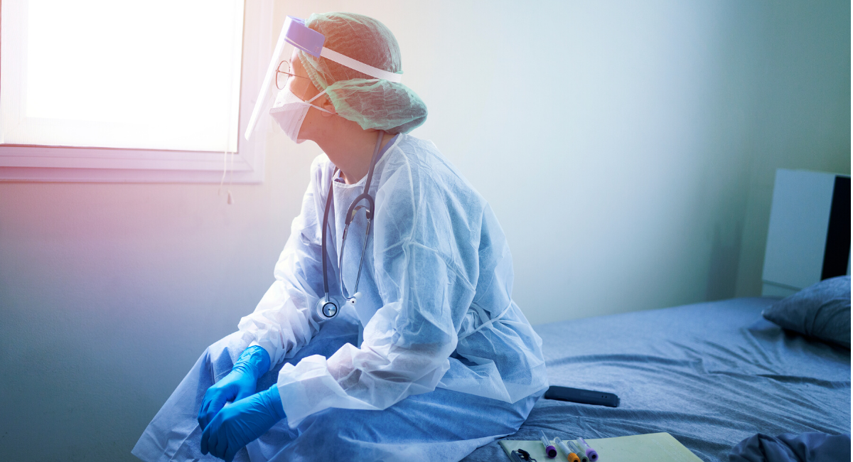 healthcare-worker-in-ppe-sitting-quietly-alone.jpg